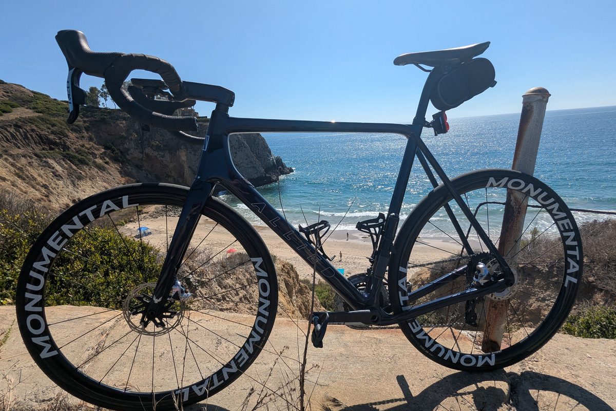 Road bike with Monumental carbon wheels overlooking the ocean